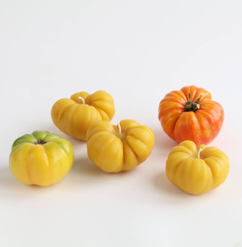 Artifaqt - Heirloom Tomato Beeswax Candle: Red / Small, featuring yellow beeswax candles shaped like tomatoes, made in collaboration with Kneehigh Farm and Swarmbustin’ Honey.