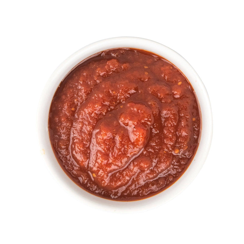 Beth's Farm Kitchen - Farm Ketchup - Low Sugar in a white bowl, showcasing its thick, bright-red texture, made with local, natural ingredients for versatile food pairing.
