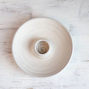 Handcrafted Palo Santo burning dish with a matte glaze, featuring a central holder for wood and a spiral pattern, ideal for mindful rituals.