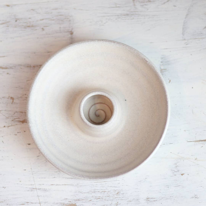 Handcrafted Palo Santo burning dish with a matte glaze, featuring a central holder for wood and a spiral pattern, ideal for mindful rituals.