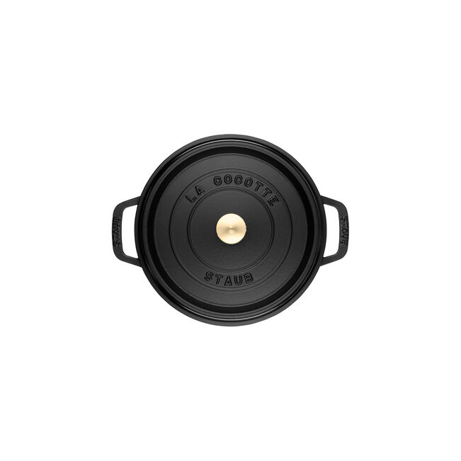 Staub | Round Cocottes - 5.5 qt Matte Black: Top-down view of a black enameled cast-iron Dutch oven with brass knob and embossed lid.