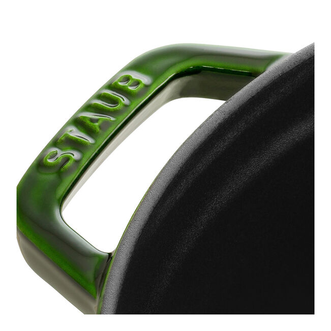 Staub | Round Cocottes - 7 qt Basil: Close-up of a green enamel handle and black interior, showcasing its craftsmanship for versatile cooking.