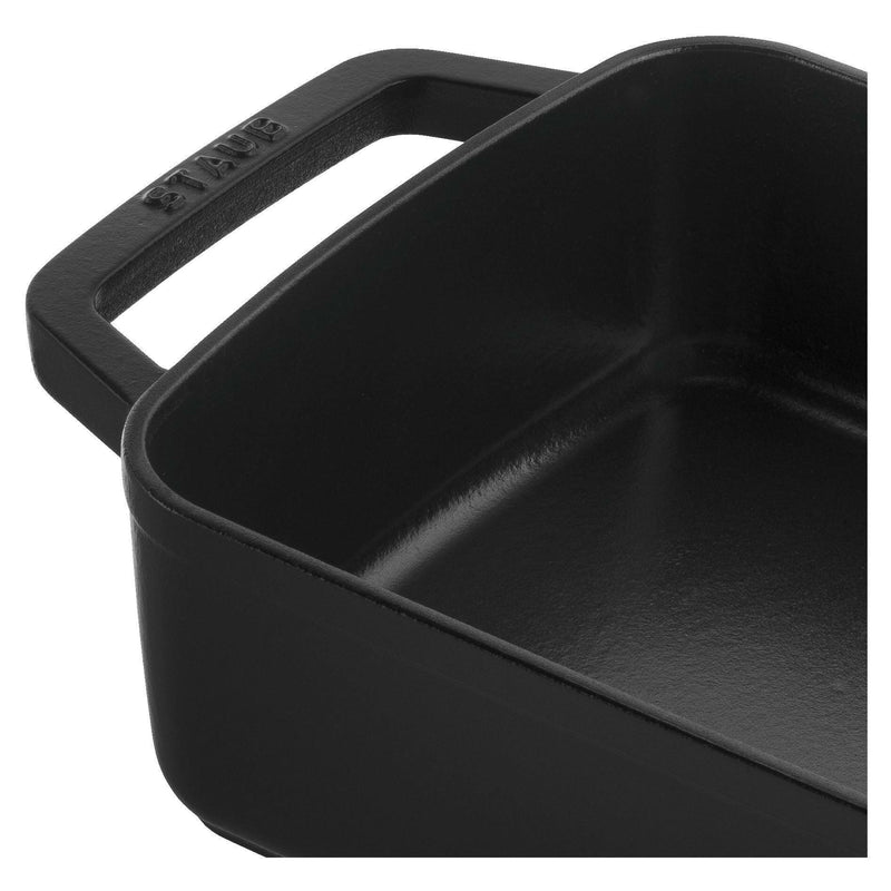 Staub | Cast-Iron Rectangular Roasting Pan 10 x 15, features a durable black matte enamel interior, ideal for browning and roasting, suitable for various heat sources.