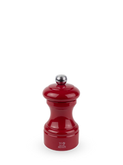 Peugeot | Bistro Salt Mill in Passion Red, featuring a glossy enamel finish, chrome knob, and iconic lion logo, offering adjustable grinding with lifetime warranty.