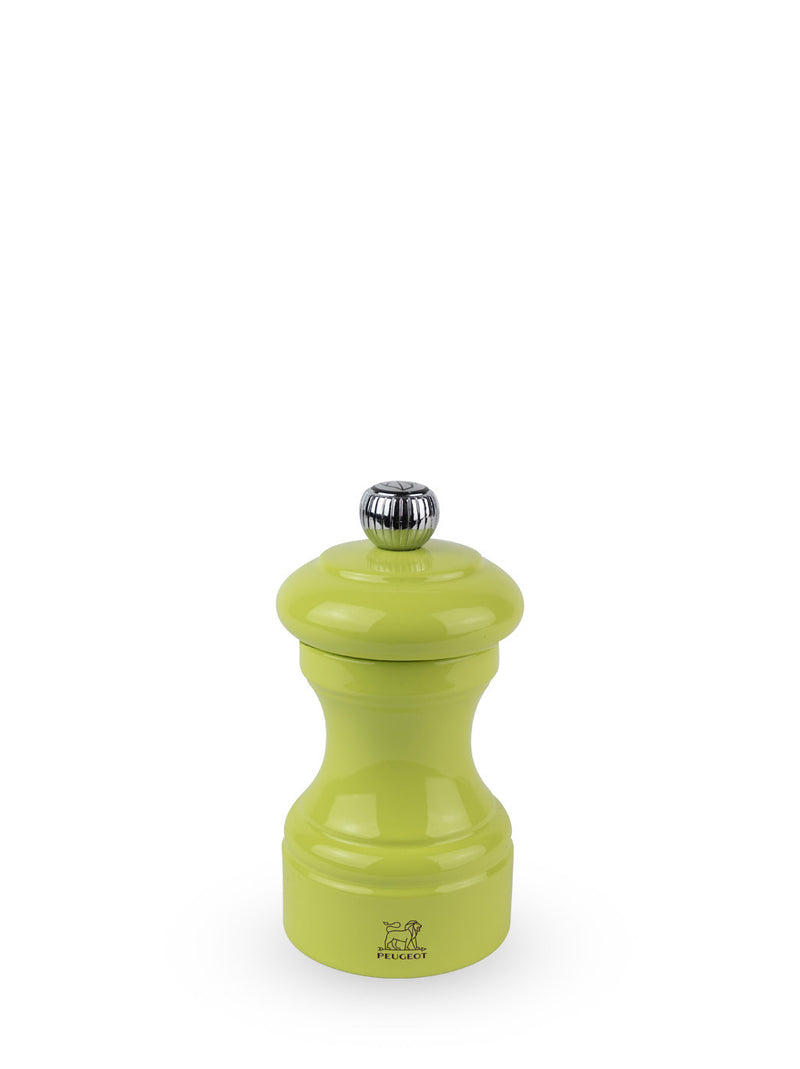 Peugeot | Bistro Pepper Mill, Green Pistachio: A lime-green, hourglass-shaped pepper mill with a metal knob and Peugeot lion logo, embodying French craftsmanship.