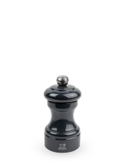 Peugeot | Bistro Salt Mill, Slate: Glossy-black pepper mill with Peugeot lion logo, adjustable top knob, and hourglass body, reflecting timeless elegance and high-performance design.