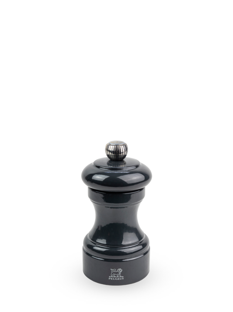Peugeot | Bistro Salt Mill, Slate: Glossy-black pepper mill with Peugeot lion logo, adjustable top knob, and hourglass body, reflecting timeless elegance and high-performance design.