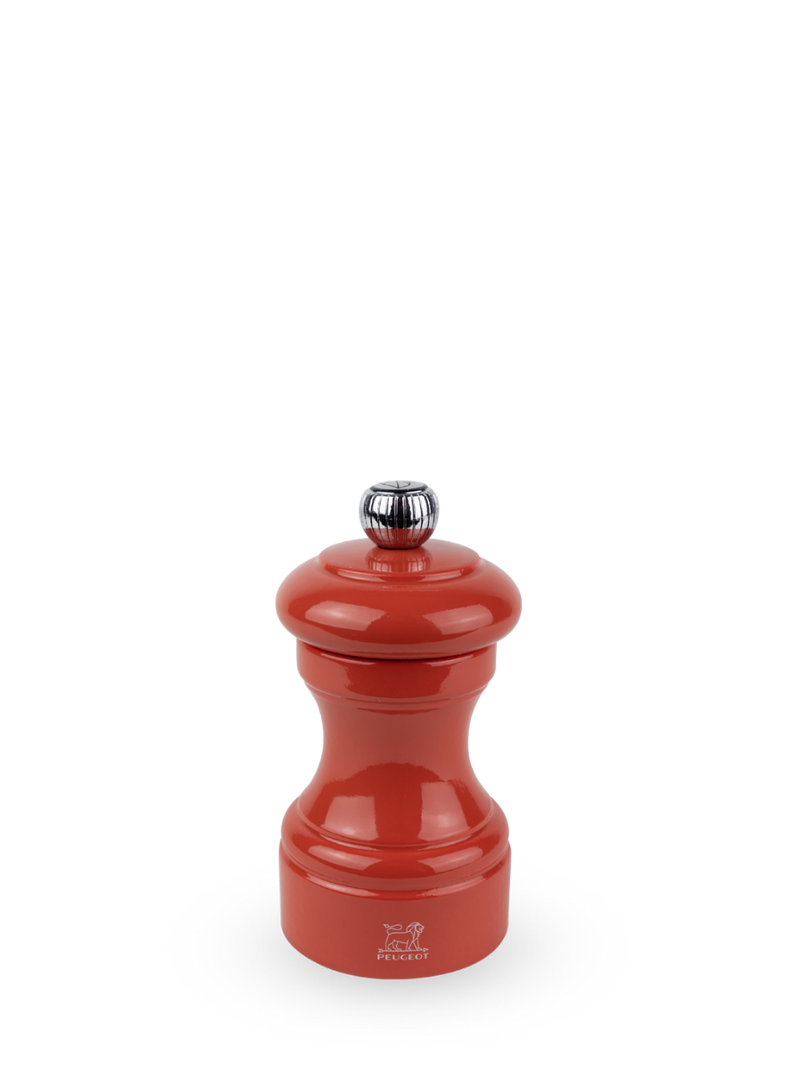 Peugeot | Bistro Pepper Mill, Terracotta: Glossy red pepper grinder with chrome knob, showcasing sustainable French craftsmanship, perfect for gourmet cooking enthusiasts.