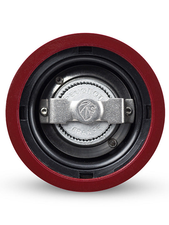 Peugeot | Paris u'Select Wooden Salt Mill, Passion Red, showcasing the metal burr assembly with 'Peugeot France' and lion logo on the adjustment collar, emphasizing precision seasoning.
