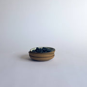 Sarah Kersten - Olive Dish: Basin Collection: Black, showcased holding fresh blueberries, highlighting its versatility and elegant design, ideal for food presentation in any kitchen setting.