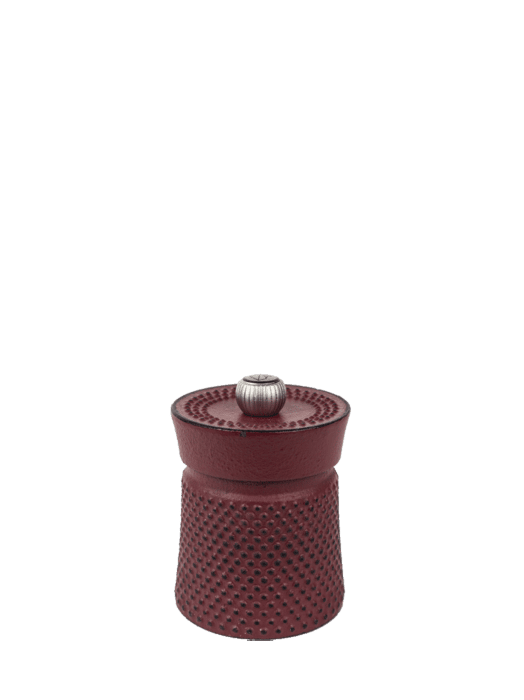 Peugeot Bali Cast Iron Pepper Mill, 3 Inches - Red, featuring a dotted grip and adjustable knob, filled with aromatic Sichuan pepper for enhanced culinary experiences.