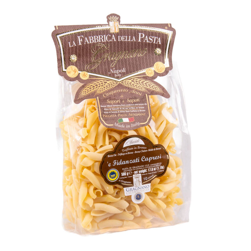 Zia Pia - Fidanzati Capresi pasta by La Fabbrica della Pasta in a clear 500g bag, highlighting its intertwined shape and bronze-drawn texture, ideal for diverse sauces.