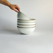 Sarah Kersten - Ramen Bowl: Pacific White held by a hand, showcasing its versatile design for noodles, salads, and more, crafted from ceramic with a smooth finish.