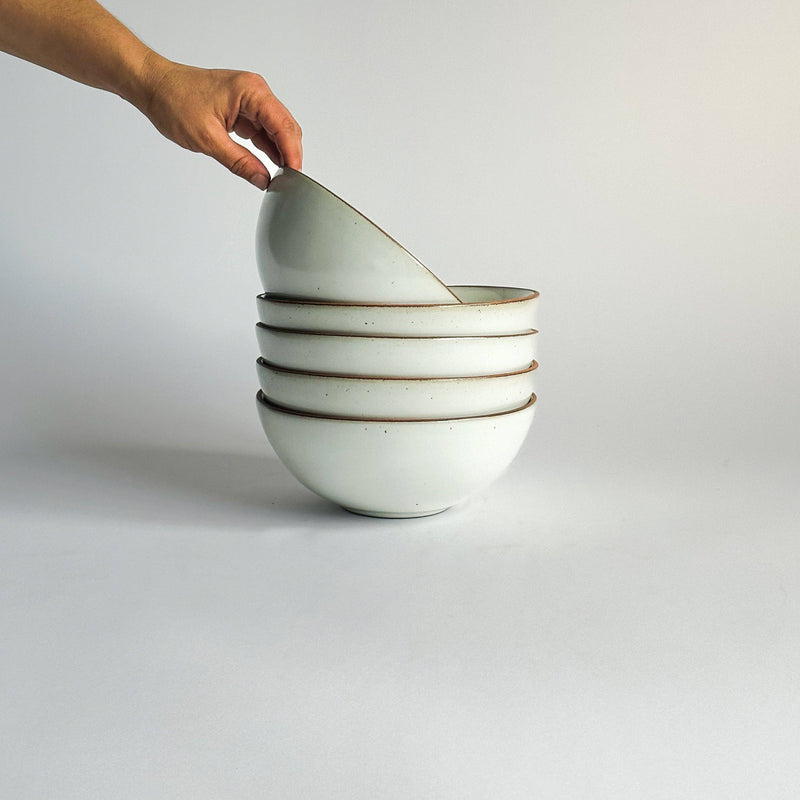 Sarah Kersten - Ramen Bowl: Dove Grey, held in hand, showcasing its versatile design ideal for noodles, salads, and more, fitting effortlessly into any kitchen setting.