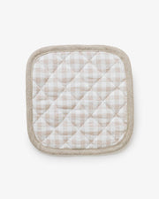 MagicLinen pot-holder with quilted detailing, showcasing a close-up of its fabric texture, designed for practical heat protection in the kitchen.