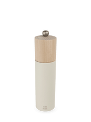 Peugeot Boreal Salt + Pepper Mill with matte-white base, natural wood top, and metal knob, showcasing elegant design and precise salt grinding mechanism.