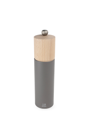 Peugeot | Boreal Pepper Mill, Rock Gray: A tall, cylindrical tabletop grinder with a wooden top and matte grey metal body, featuring Peugeot's durable steel mechanism.