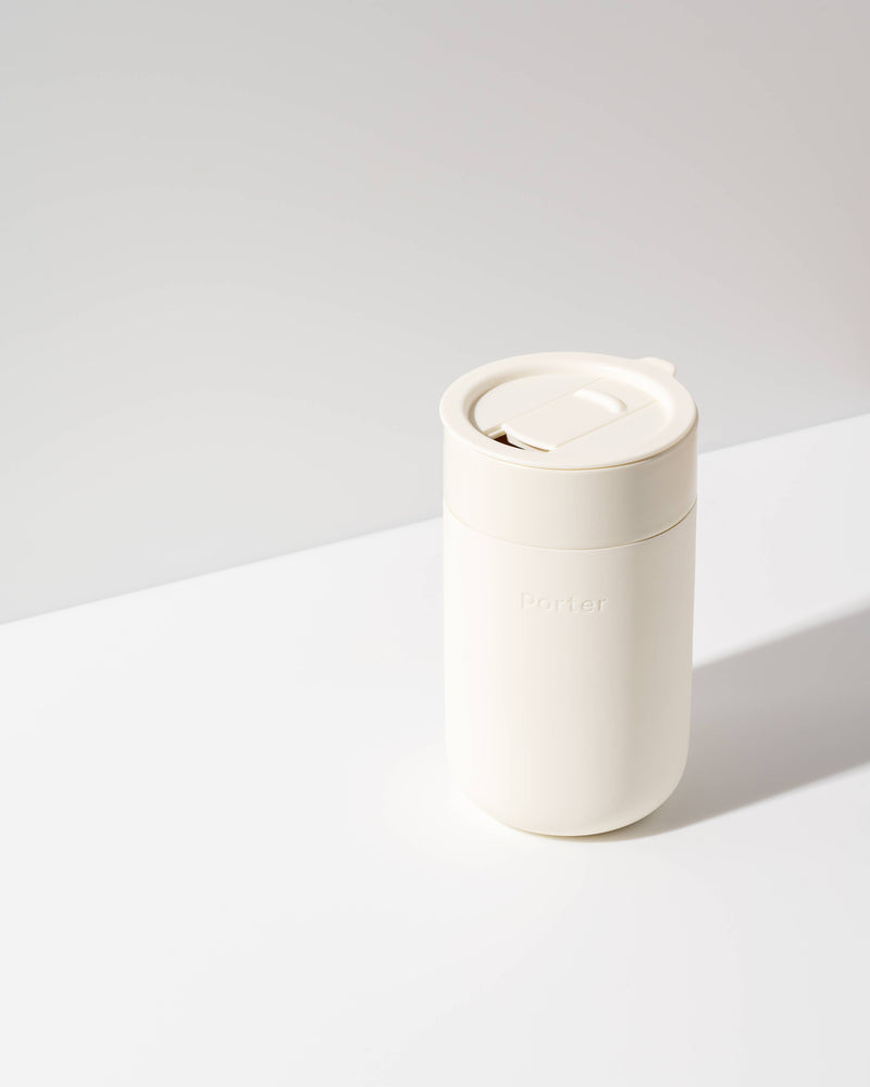 W&P - Ceramic Reusable Coffee Mug 16oz: Charcoal, featuring a durable ceramic body with a matte silicone sleeve and a splash-resistant lid. Ideal for eco-conscious coffee lovers.