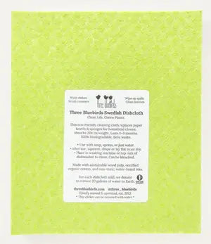 Three Bluebirds Swedish Dishcloths - Daisies on Green, featuring a paper with usage instructions, ideal for sustainable cleaning in your kitchen.