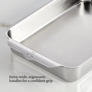 Hestan | Oven Bond Tri-Ply Bakeware, Rectangular Baker with extra-wide ergonomic handles for a confident grip, crafted from triple-bonded stainless steel, shown empty on a countertop.