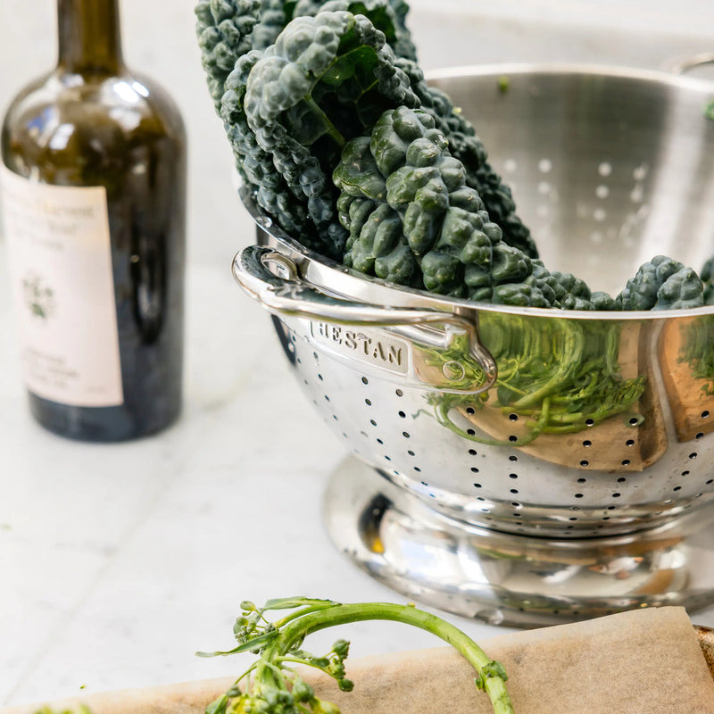 Hestan Provisions | Stainless Steel Colanders, 5 Quart, filled with kale; ideal for straining or rinsing kitchen prep. Durable, dishwasher safe.