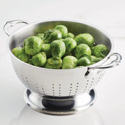 Hestan Provisions | Stainless Steel Colanders, 5 Quart, filled with fresh Brussels sprouts, showcasing its capacity and superior drainage, perfect for kitchen tasks at Athens Cooks.