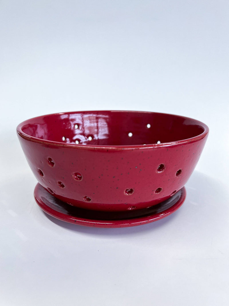 RachaelPots - Large Berry Bowl With Dish: Black, a hand-thrown ceramic colander with drainage holes and matching saucer, perfect for rinsing or displaying fruits.