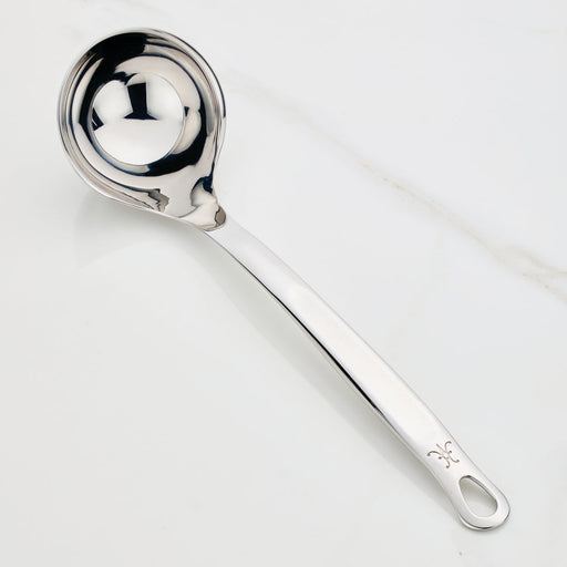 Hestan Provisions | Stainless Steel Ladle, 13 (5oz) on countertop, showcasing its deep bowl, ergonomic handle, and polished finish designed for effortless, drip-free pouring.