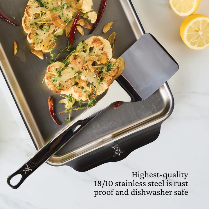 Hestan Stainless Steel Spatula/Turner on a food tray with lemons, showcasing its sleek design and functionality, perfect for versatile kitchen use.