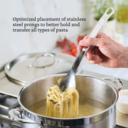 Hestan Provisions | Stainless Steel Pasta Fork, 13, lifting spaghetti from a pot, showcasing precise prong design for optimal pasta transfer.