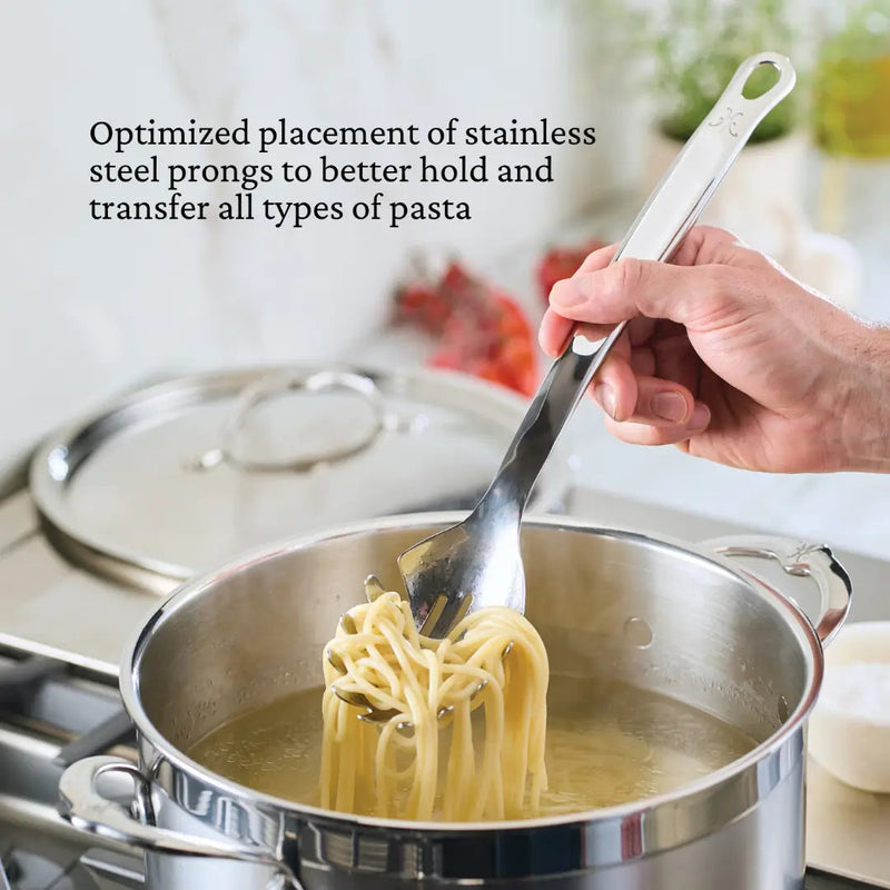 Hestan Provisions | Stainless Steel Pasta Fork, 13, lifting spaghetti from a pot, showcasing precise prong design for optimal pasta transfer.