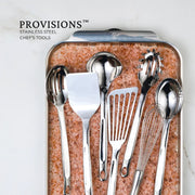 Hestan Provisions | Stainless Steel Pasta Fork, 13 on pink salt tray, showcases precision-crafted, ergonomic design with artisan-polished finish and embossed monogram, ideal for discerning cooks.