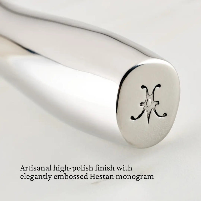 Hestan Provisions | Stainless Steel French Whisk, 9, featuring a polished metal handle with an embossed H monogram, designed for rigorous whisking and durability.