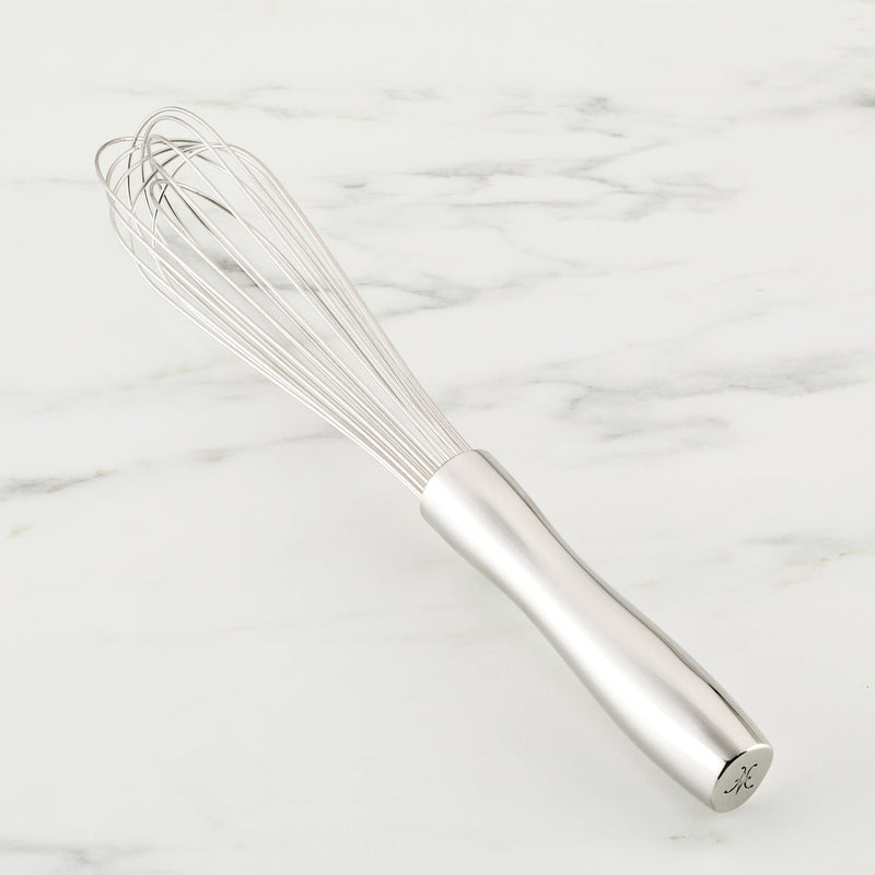 Hestan Provisions | Stainless Steel French Whisk, 9 on marble surface, showcasing its polished finish and ergonomic design, ideal for precise whisking and mixing tasks.