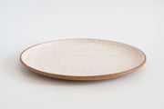 RachaelPots - Serving Platter: Sage, a handmade, off-white ceramic plate with an earthy brown rim, perfect for showcasing dishes, crafted from speckled stoneware.