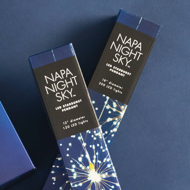 Napa Night Sky LED Starburst Lights by Napa Home & Garden, featuring 120 warm white LEDs and 40 copper strands, packaged in a blue box.