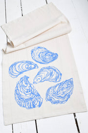 Hearth and Harrow - Oyster Tea Towel in Blue-violet, featuring an intricate blue oyster design on organic cotton, perfect for enhancing any kitchen decor.