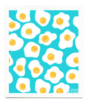 Bespoke Provisions - Eggs Swedish Dishcloth featuring a pattern of eggs, designed for hygienic cleaning, made from biodegradable materials, suitable for various kitchen surfaces.