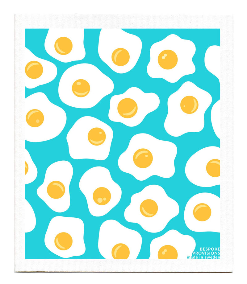 Bespoke Provisions - Eggs Swedish Dishcloth featuring a pattern of eggs, designed for hygienic cleaning, made from biodegradable materials, suitable for various kitchen surfaces.