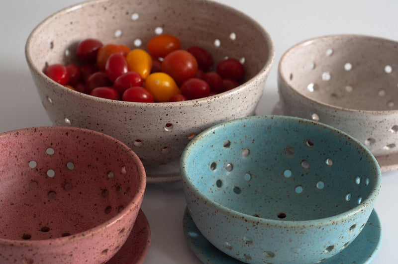 RachaelPots - Small Berry Bowl With Dish: Coral, featuring a ceramic bowl with holes for draining, paired with a small saucer, ideal for berries or cherry tomatoes.