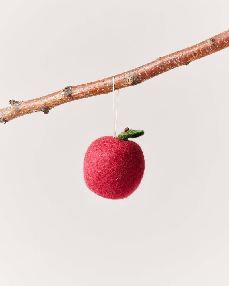 Farmhouse Pottery - Felted Fruit Ornament: Apple hanging from a bare branch, handcrafted from 100% wool with a tiny green leaf and brown stem.