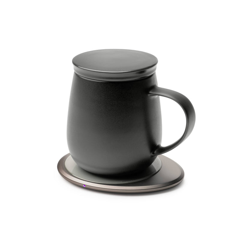 OHOM - Ui 3 Self-heating Mug Set: Jasmine White on a smart warming base, maintaining drink temperature and offering wireless charging for devices.