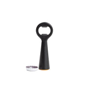 L'Atelier du Vin - USA - Bottle Opener - LE BRASSEUR – BLACK, stainless steel with a black handle, stands upright by a removed bottle cap, showcasing its sleek, functional design.