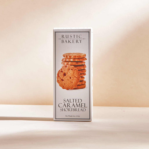 Rustic Bakery - Salted Caramel Shortbread (12 Boxes) featuring buttery shortbread with salted caramel, displayed in a rectangular package with stacked cookies. Net weight: 4 oz (113 g).