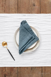 Set of 2 linen napkins on a plate with a spoon, showcasing premium quality and versatility for stylish table decor by MagicLinen.