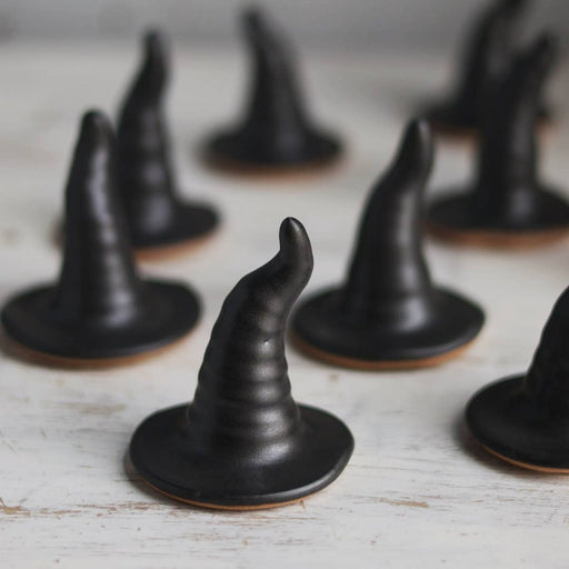 Gravesco Pottery - Black Witch Hat ring holder on light wood, showcasing its handmade ceramic design, perfect for Halloween decor or jewelry display.