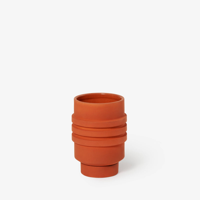 Areaware - Strata Plant Vessel: Yellow, a ceramic planter with layered shapes, concealing its saucer, inspired by Simone Brewster’s sculptural design heritage.