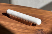 Verve Culture - White Marble Rolling Pin and Wood Base, featuring a sleek marble cylinder with subtle veining, elegantly displayed on a wooden cradle for home bakers.