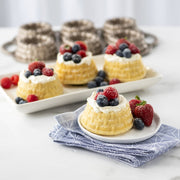 Nordic Ware | Shortcake Baskets Pan showcasing a beautifully detailed dessert topped with fresh berries, ideal for creating impressive shortcake or molded gelatin desserts.
