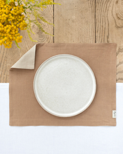 MagicLinen - Double Layer Linen Placemat Set of 2: Latte, featuring a soft linen placemat on a wooden table, ideal for dining decor and table protection.
